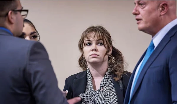 Hannah Gutierrez-Reed, center, talks with her attorney and defense team during the trial. (Jim Weber/AP)