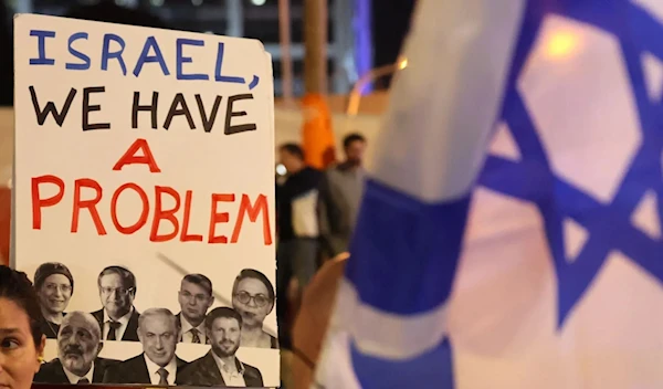 An Israeli protester attends a rally against Prime Minister Benjamin Netanyahu's new hard-right government in “Tel Aviv” on Jan. 21. (AFP via Getty Images)