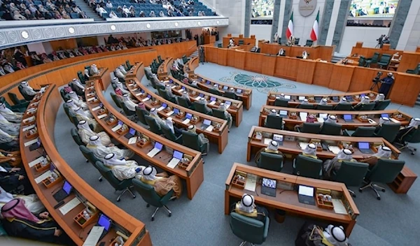 Members of parliament take part of the new Emir of Kuwait Sheikh Meshal Al Ahmad Al Sabag’s oath ceremony at the National Assembly in Kuwait city, Wednesday, Dec.20, 2023. (AP)