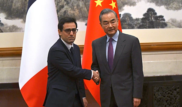 France's Minister for Foreign and European Affairs Stephane Sejourne,with China's Foreign Minister Wang Yi during a meeting in Beijing, China Monday, April 1, 2024. (AP/Pool)