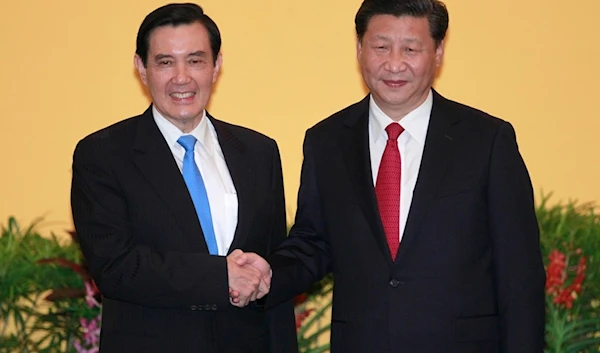 Then Taiwan's President Ma Ying-jeou, left, and China's President Xi Jinping shake hands at the Shangri-la Hotel on Nov. 7, 2015 (AP)