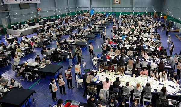 National Election Commission officials sort out ballots for counting at the parliamentary election in Seoul, South Korea, on Wednesday, April 10, 2024.(AP)