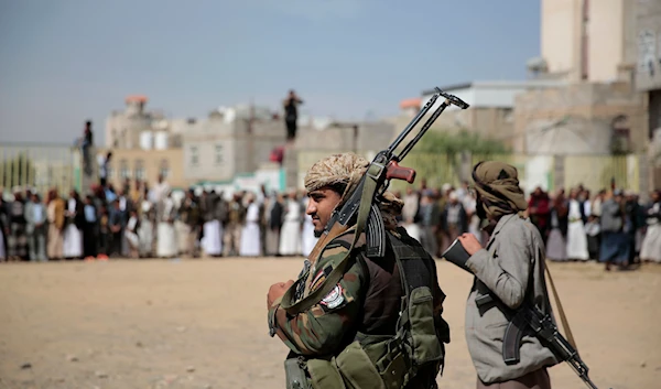 Armed Houthi fighters attend the funeral procession of Yemeni Ansar Allah fighters who were killed in recent fighting with the Saudi-led coalition of aggression in Sanaa, Yemen, November 24, 2021 (AP)