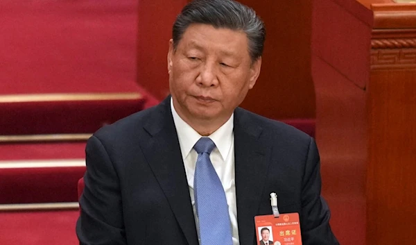 Chinese President Xi Jinping attends during the second plenary session meeting of the National People's Congress (NPC) in the Great Hall of the People in Beijing, China, Friday, March 8, 2024. (AP)