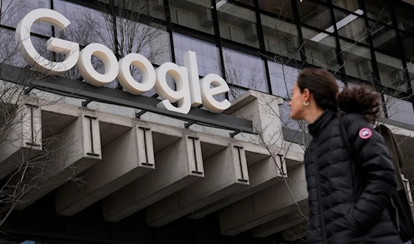 A woman walks past a google building in New York, on Monday, Feb.26, 2024. (AP)