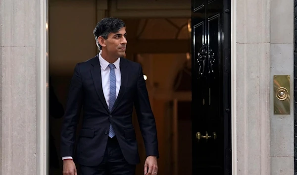 Britain's Prime Minister Rishi Sunak waits to greet the President of Rwanda Paul Kagame on the doorstep of 10 Downing Street in London, Tuesday, April 9, 2024. (AP)