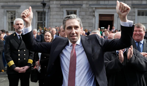 The new Prime Minister of Ireland, Simon Harris gestures as he is applauded by fellow lawmakers outside Leinster House, in Dublin, Ireland, Tuesday, April 9, 2024.(AP)