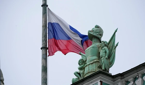 A Russian national flag is at half-mast over the Hermitage Museum in St. Petersburg, Russia, Sunday, March 24, 2024. (AP)