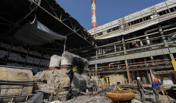 Workers repair damaged thermal power plant, one of the country's largest, recently destroyed by Russian missiles in Ukraine Friday, April 12, 2024. (AP)