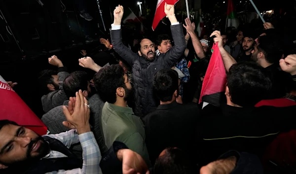 Iranian demonstrators chant slogans during an anti-Israeli gathering in front of the British Embassy in Tehran, Iran, early Sunday, April 14, 2024.  (AP )