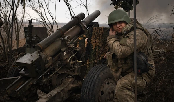 Ukrainian soldiers of the 71st Jaeger Brigade fire a M101 howitzer towards Russian positions at the frontline, near Avdiivka, Donetsk region, Ukraine, Friday, March 22, 2024. (AP)