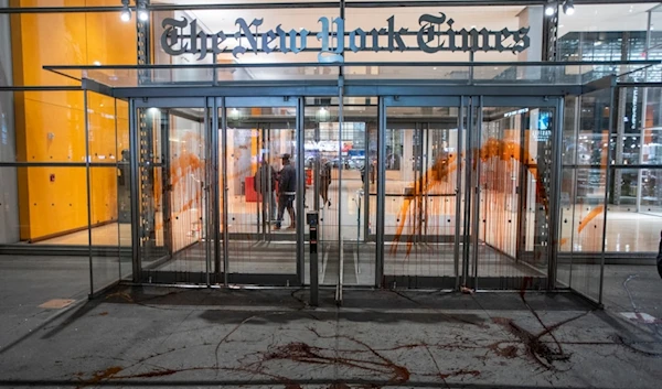 Photo shows The New York Times building entrance after being vandalized with red tint by Pro-Palestinian demonstrators as they march calling for a ceasefire in Gaza, Nov. 10, 2023, in New York. (AP)