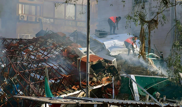 In this photo released by the official Syrian state news agency SANA, emergency service workers clear the rubble following the Israeli strike in Damascus, Syria, Monday, April 1, 2024. (AP)