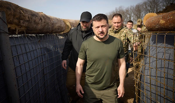 Ukrainian President Volodymyr Zelenskyy inspects the fortification lines in Kharkiv, Tuesday, April 9, 2024. (Ukrainian Presidential Press Office via AP)