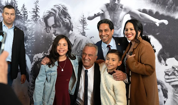 Independent presidential candidate Robert F. Kennedy, Jr. poses for a photo with a family of supporters prior to a campaign event, Saturday, March 30, 2024, in Los Angeles. (AP)