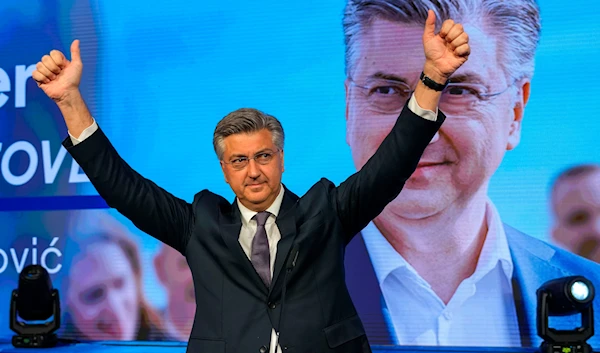 Prime Minister incumbent Andrej Plenkovic waves after claiming victory in a parliamentary election in Zagreb, Croatia, Thursday, April 18, 2024. (AP)