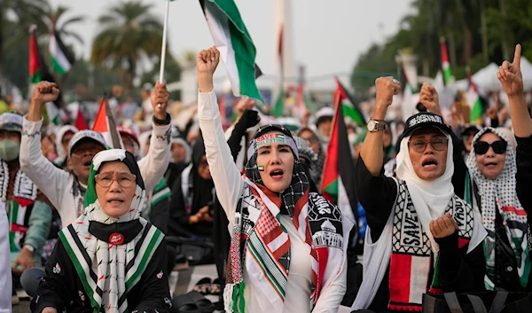 Protesters shout slogans during a rally and prayer in support of the Palestinians in Gaza, in Jakarta, Indonesia, Sunday, April 7, 2024. (AP)