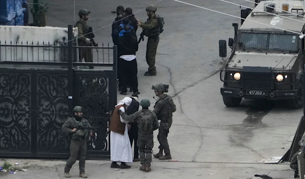 Israeli occupation detaining Palestinian men during a raid in Nur Shams refugee camp in Tulkarm, West Bank on Wednesday, Jan. 3, 2024.(AP)