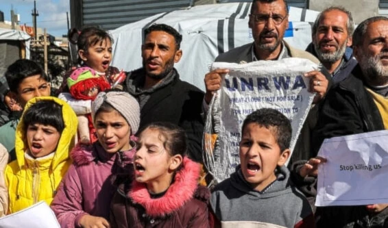 Palestinians demonstrate in Rafah in the southern Gaza Strip calling for continued international support to the United Nations Relief and Works Agency for Palestine Refugees in the Near East (UNRWA), January 30, 2024. (AFP)