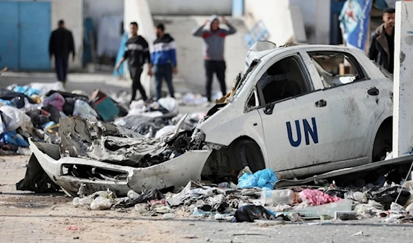 Palestinians walk through the destruction left by the Israeli air and ground offensive on the Gaza strip in Gaza City, Saturday, February 10, 2024. (AP)