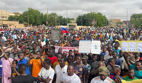 Supporters of Niger's ruling junta, gather for a protest called to fight for the country's freedom and push back against foreign interference, in Niamey, Niger, Thursday, Aug. 3, 2023. (AP)