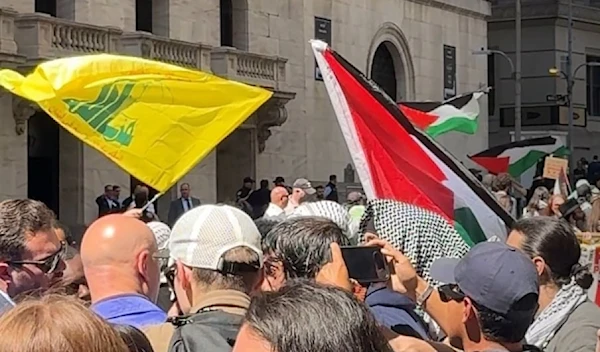 Image emerging on social media showing Hezbollah's flag alongside Palestine's flag flying in on Wall Street, New York, US, on April 25, 2024. (Social media)