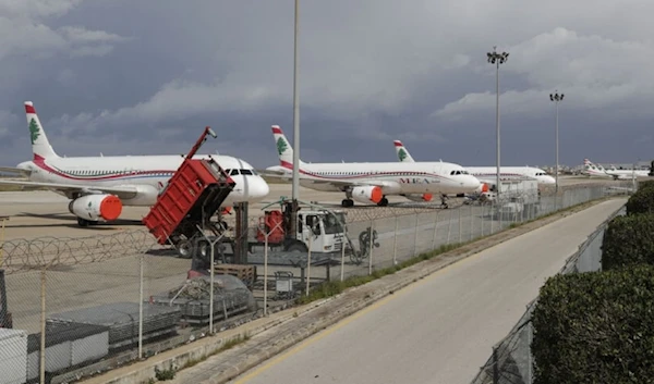 Lebanon's Middle East Airlines (MEA) planes are parked on the tarmac of Beirut International Airport on March 19, 2020. (AFP)