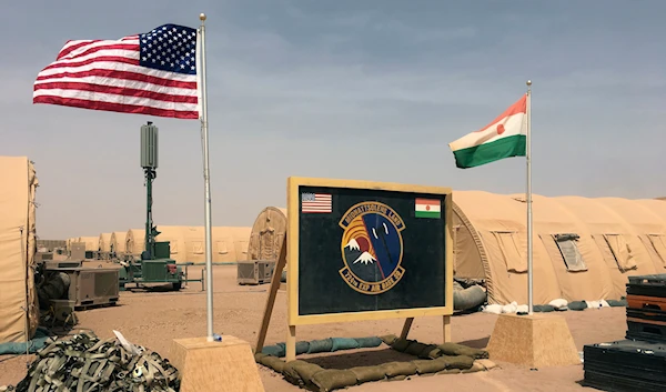 April 16, 2018, a U.S. and Niger flag are raised side by side at the base camp for air forces and other personnel supporting the construction of Niger Air Base 201 in Agadez, Niger. (AP)