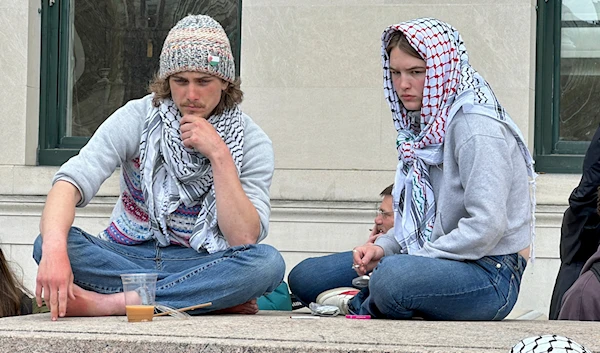 Young people attend a media press conference outside a tent camp on the campus of Columbia University in New York on Wednesday, April 24, 2024. (AP)