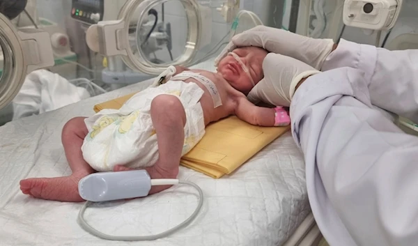 A Palestinian baby girl, Sabreen Jouda, who was delivered prematurely after her mother was killed in an Israeli strike along with her husband and daughter, lies in an incubator in the Emirati hospital in Rafah, Gaza. Sunday, April 21, 2024. (AP)