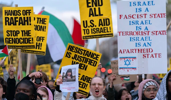 Demonstrators march to the White House in support of Palestinians, Saturday, March 30, 2024, in Washington. (AP)