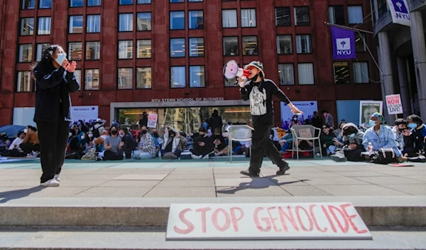 New York University students and pro-Palestinian supporters rally outside the NYU Stern School of Business building, Monday, April 22, 2024, in New York. (AP)