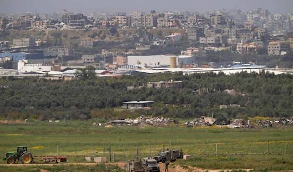 Israeli troops are seen near the separation line with Gaza Strip, in southern Palestine, Wednesday, March 27, 2024. (AP Photo/Ohad Zwigenberg)