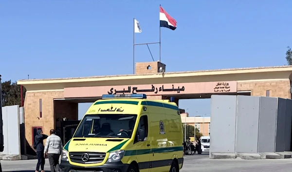 An ambulance carrying bodies of the foreign humanitarian aid workers killed in a recent Israeli airstrike in Gaza crosses the Rafah border crossing between Egypt and the Gaza Strip, Wednesday, April 3, 2024 (AP Photo/Ahmed Abudraa)