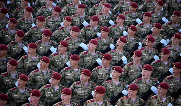 Russian soldiers march toward Red Square to attend a Victory Day military parade in Moscow, Russia, Tuesday, May 9, 2023, marking the 78th anniversary of the end of World War II. (AP)