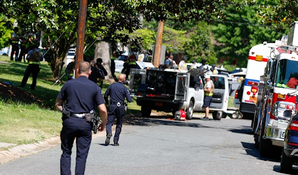 Charlotte Mecklenburg Police Department officers walk in the neighborhood where a shooting took place in Charlotte, N.C., Monday, April 29, 2024. (AP)