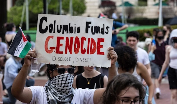 Student protesters march around their encampment on the Columbia University campus, Monday, April 29, 2024, in New York. (AP)