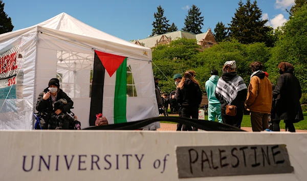 A sign is shown written over to read "University of Palestine" at a pro-Palestinian encampment on the University of Washington campus Monday, April 29, 2024, in Seattle. (AP)