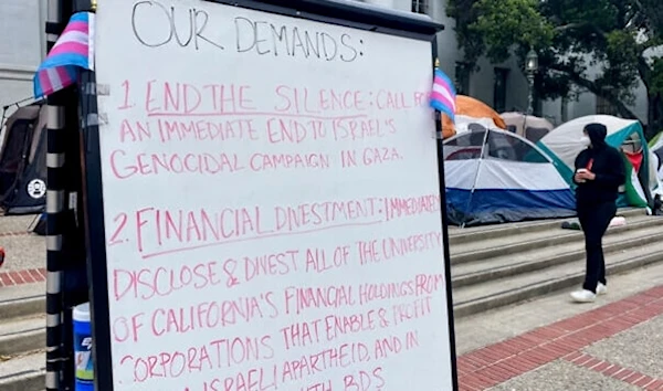 A sign is seen as pro-Palestinian protesters gather to demonstrate against Israeli genocide against Palestinians in Gaza, in front of Sproul Hall on the campus of the University of California, Berkeley, in Berkeley, California, April 23, 2024. (AP)