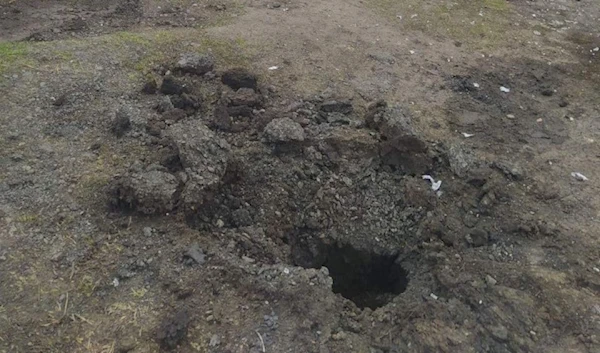 A crevasse is pictured after a kamikaze drone attacked a military unit in Ribnita district. (@nexta_tv)