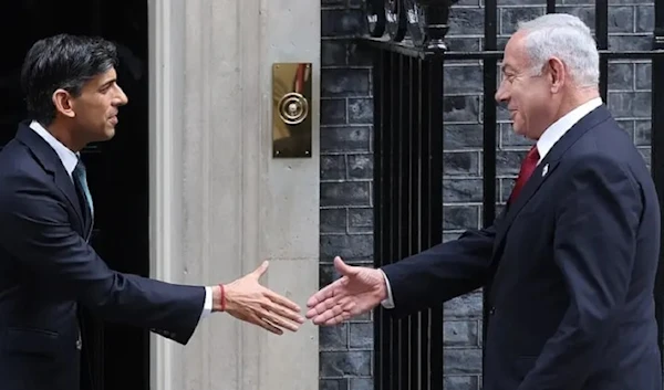 UK’s Prime Minister Rishi Sunak (L) greets Israeli Prime Minister Benjamin Netanyahu on the steps of 10 Downing Street in central London on March 24, 2023, ahead of their meeting. (AFP)