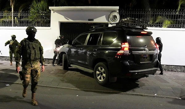 Ecuadorian police breaking into the Mexican embassy in Quito, Ecuador, Friday, April 5, 2024. (AP)