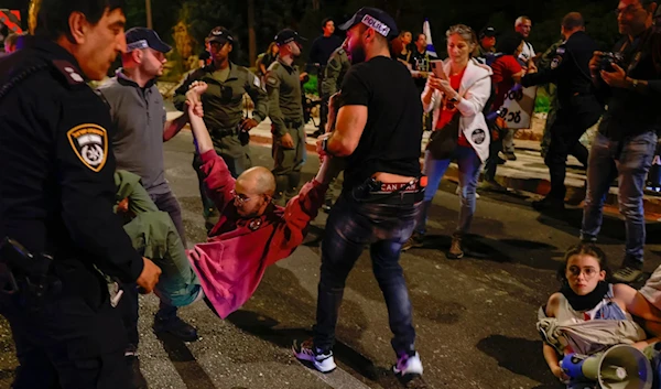 Anti-government protesters arrested near the Israeli Parliament in al-Quds on April 1, 2024. (AFP)