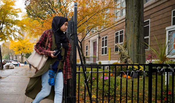 A woman arrives to vote at a polling station, Tuesday, Nov. 6, 2018, in the Brooklyn borough of New York. (AP)