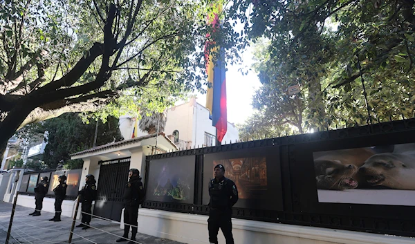 Mexican police stand guard outside the Ecuadorian Embassy, in Mexico City, Saturday, April 6, 2024. (AP)