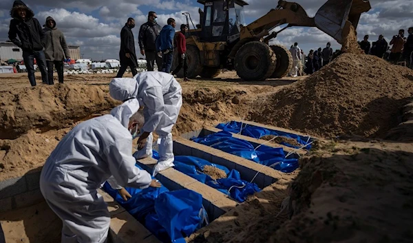 Palestinians bury the bodies, of people who were killed in Israeli occupation bombardment in Gaza, during a mass funeral in Rafah, Gaza Strip, Palestine, Jan. 30, 2024. (AP)