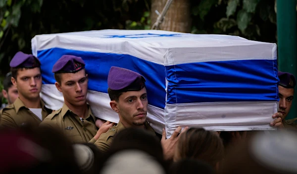 sraeli soldiers carry the flag-draped casket of Staff Sgt. Lavi Lipshitz during his funeral in the Mount Herzl Military Cemetery in Jerusalem, Wednesday, Nov. 1, 2023. (AP