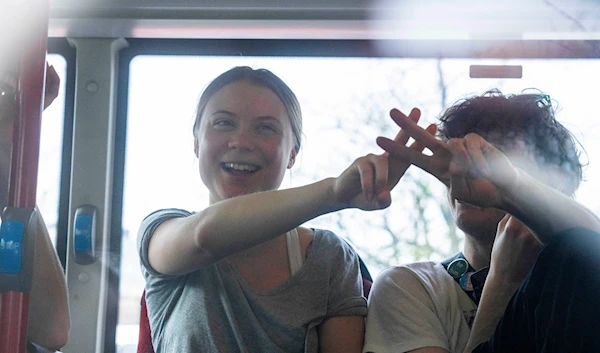 Climate activist Greta Thunberg after being detained in a bus for joining protestors during a climate protest near the Dutch parliament in The Hague, Netherlands, Saturday, April 6, 2024. (AP)