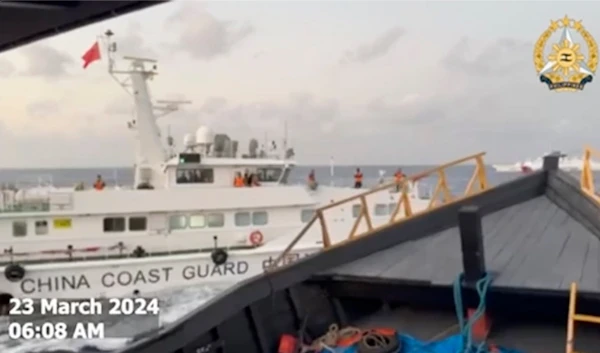 Taken from a video by the Armed Forces of the Philippines, a Chinese Coast Guard ship blocks the Philippine ship in the South China Sea , on March 23, 2024. (Armed Forces of the Philippines/AP)