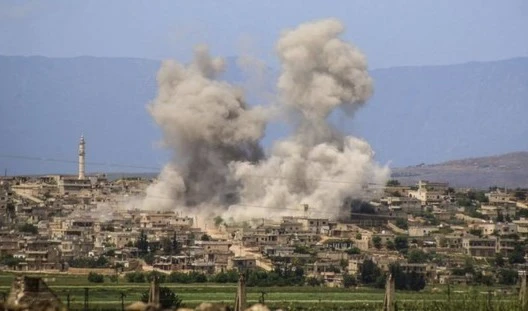 Smoke rises after Syrian government and Russian airstrikes hit Al-Habeet, southern Idlib , Syria on May 3.2019. (AP)